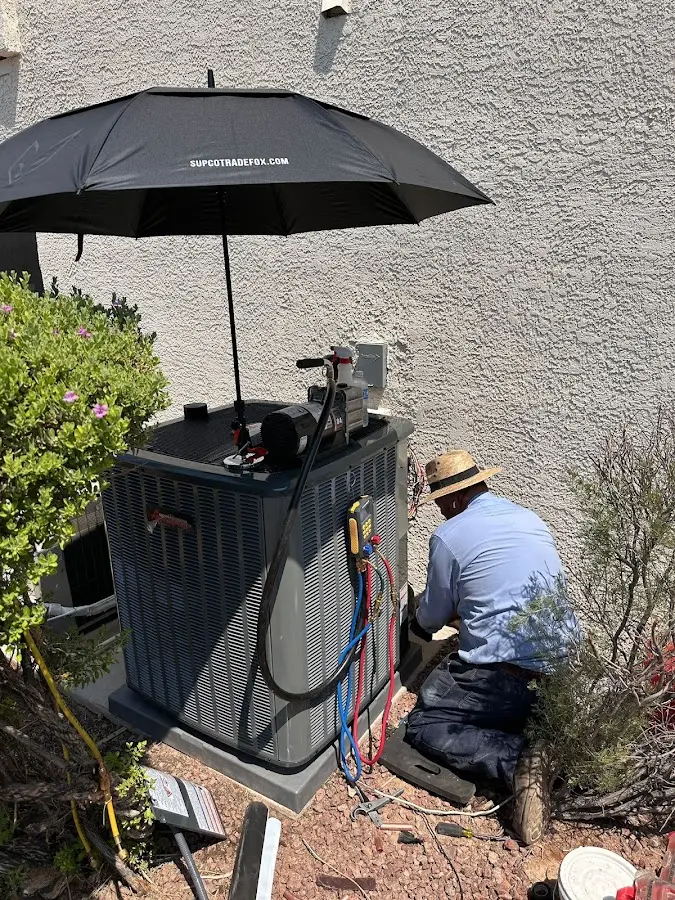 HVAC technician performing outdoor AC maintenance in Hawaiian Gardens
